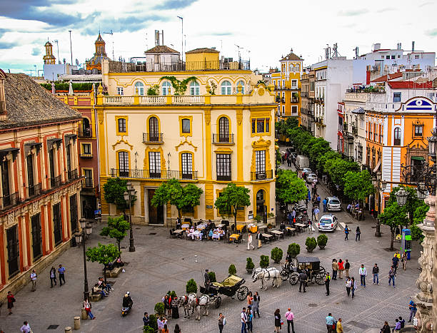 Plaza Del Triunfo in Seville, Spain with rooftops and the Santa Cruz church in the distance. Taken from the 